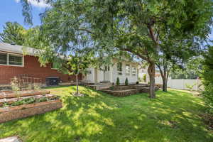 View of yard with central AC