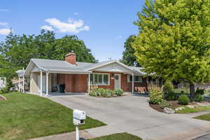 Ranch-style home with a front yard