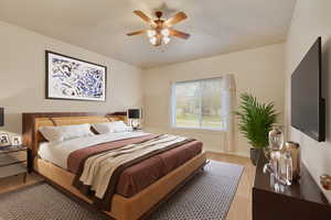 Bedroom with light hardwood / wood-style flooring and ceiling fan