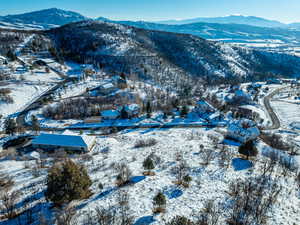 Snowy aerial view with a mountain view