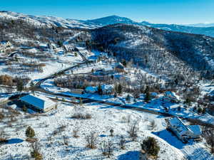 Snowy aerial view with a mountain view