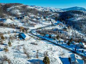 Snowy aerial view with a mountain view