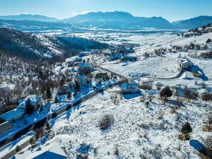 Snowy aerial view with a mountain view