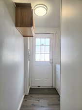 Entryway with washer / clothes dryer and dark hardwood / wood-style flooring