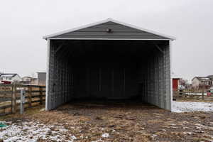 Snow covered structure with a carport