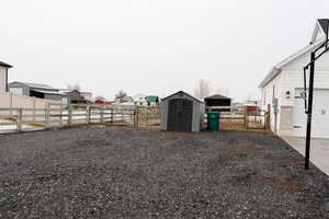 View of yard featuring a storage shed