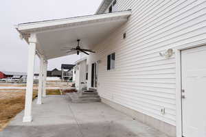 View of patio featuring ceiling fan