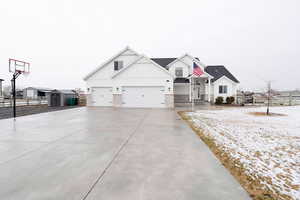 View of front of home featuring a shed