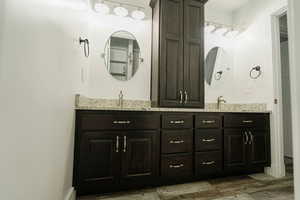 Bathroom with hardwood / wood-style floors and vanity