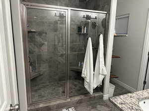 Bathroom with vanity and an enclosed shower