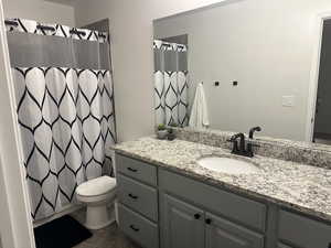 Bathroom with vanity and toilet