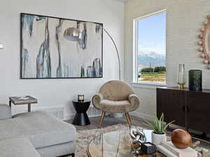 Living area featuring a mountain view and hardwood / wood-style flooring