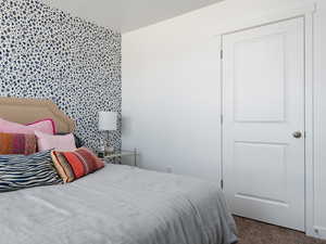 Bedroom featuring carpet