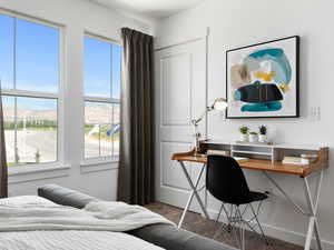 Bedroom with carpet flooring, multiple windows, and a mountain view