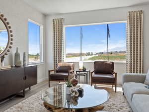 Living room featuring a mountain view and light hardwood / wood-style flooring