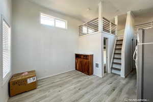 Interior space featuring light hardwood / wood-style floors and fridge