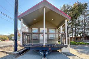 Rear view of property featuring a porch