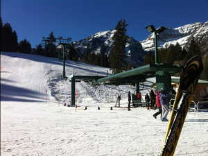 High-speed ski lift at the cozy ski village base