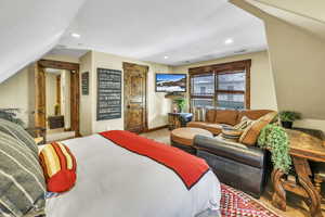 Guest bedroom with ample seating/lounging area