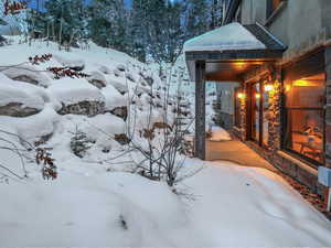 Covered patio with seasonal brook, off of fitness room