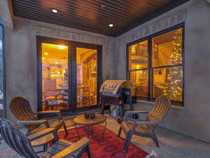 Covered patio featuring french doors opening from kitchen and dining room