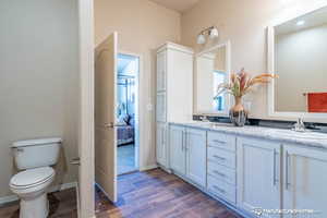 Bathroom featuring vanity and toilet