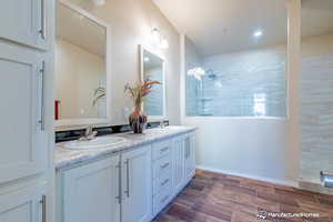 Bathroom featuring vanity and walk in shower