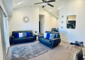Living area with a ceiling fan, carpet, baseboards, recessed lighting, and vaulted ceiling
