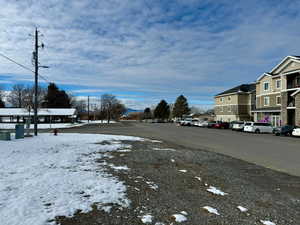 View of building and park with street in the middle. South side.