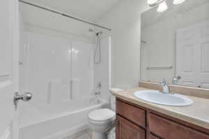 Full bathroom featuring shower / tub combination, tile patterned flooring, vanity, and toilet