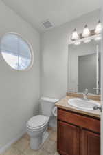 Bathroom with vanity and toilet