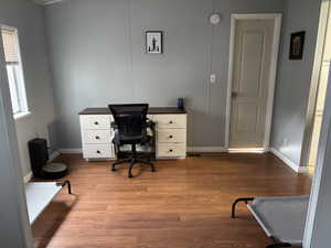 Office with hardwood / wood-style flooring