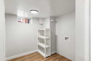 Laundry room featuring hookup for a washing machine and hardwood / wood-style floors