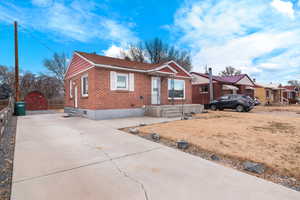 View of front of property with a storage unit