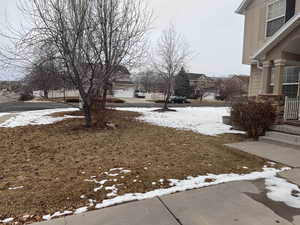 View of yard covered in snow