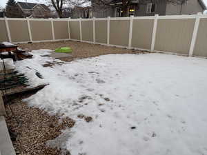 View of yard covered in snow