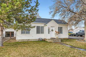 Bungalow-style home featuring a front yard