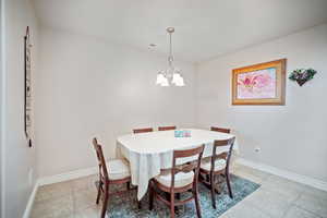 Dining area featuring a chandelier