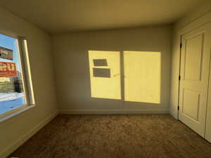 View of carpeted spare room