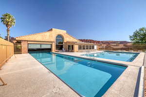 View of swimming pool with a patio area