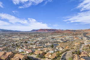 Birds eye view of property with a mountain view