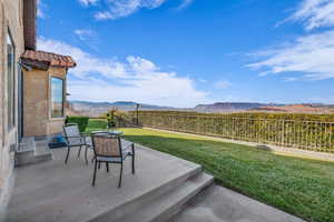 View of yard featuring a mountain view and a patio