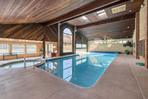 View of pool with a skylight