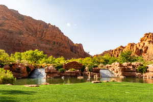 Property view of mountains with a water view