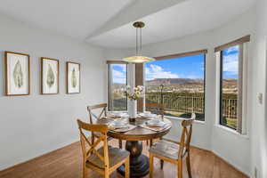 Dining area featuring a mountain view and light wood-type flooring