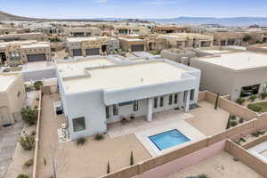 Birds eye view of property with a mountain view