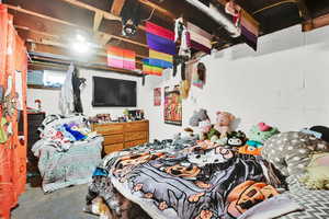 Bedroom featuring concrete flooring