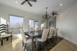 Dining room featuring crown molding and a chandelier