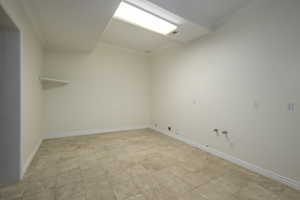 Spare room featuring ornamental molding