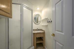 Bathroom featuring vanity and walk in shower